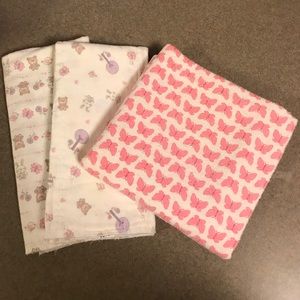 2 burping towels and a butterfly blanket